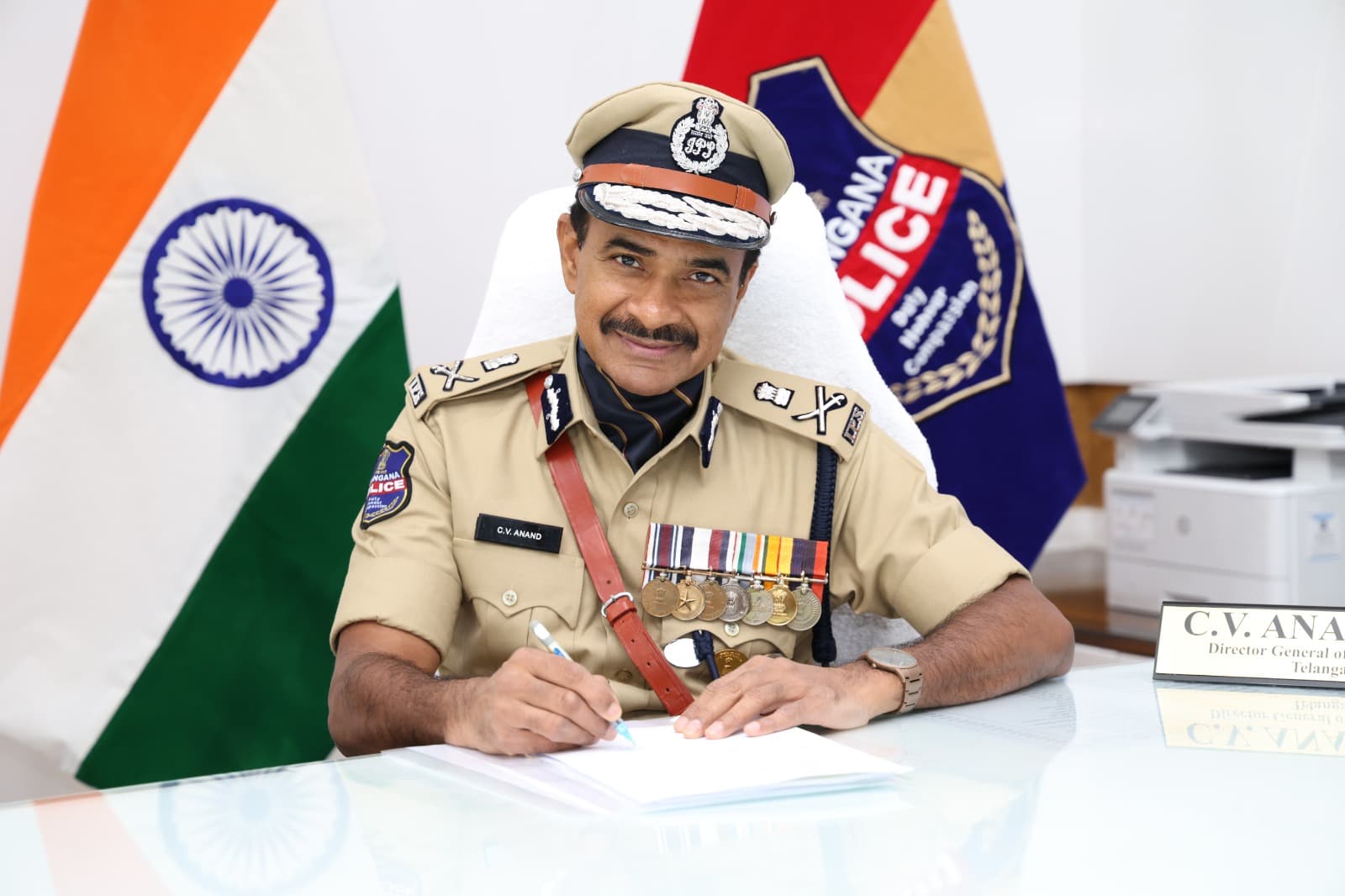 C. V. Anand in Telangana Police uniform at his desk