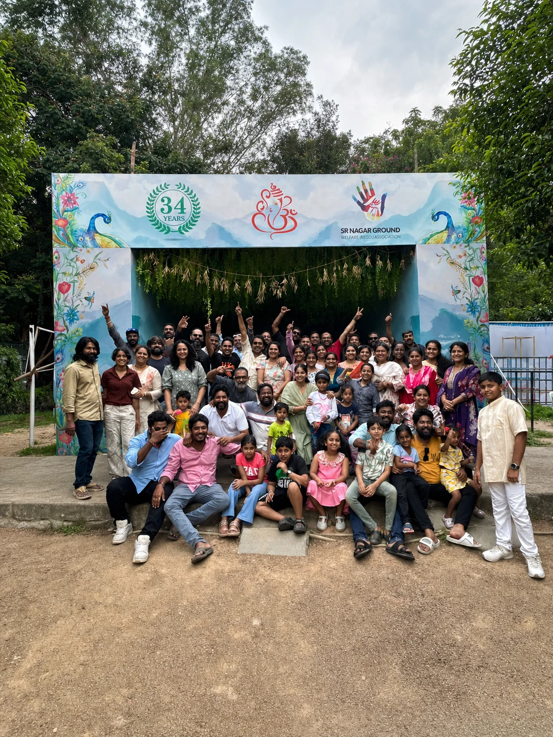 Families, children and neighbours gathered beneath the decorated SR Nagar Ground entrance